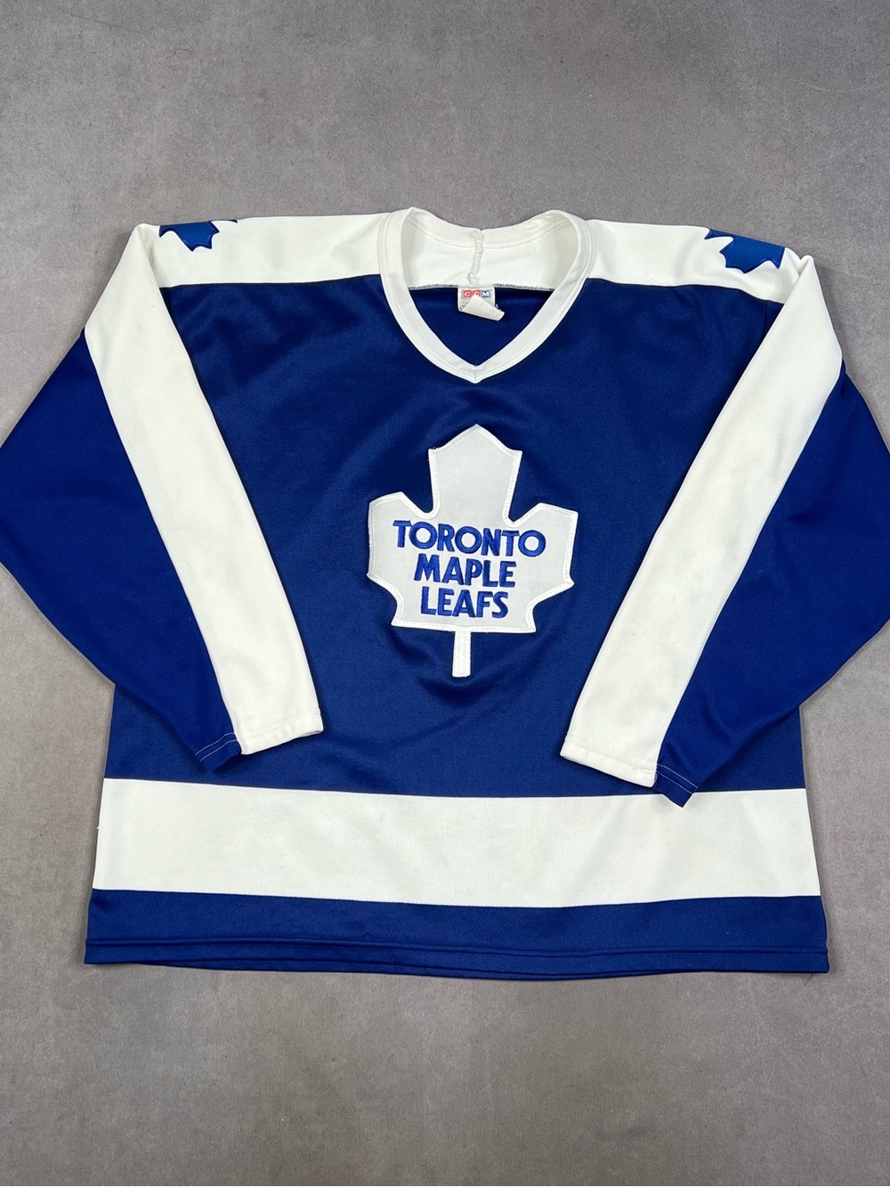 Vintage CCM Blue & White Hockey Jersey Tag Detail
